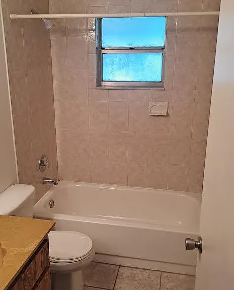 Bathrooms are tan in color, Picture shows them as pink