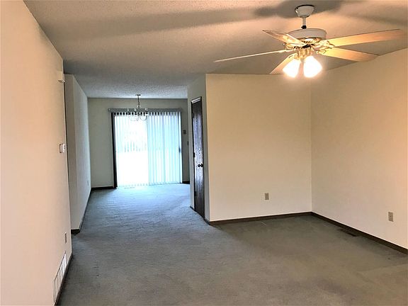 From front door looking into LR and DR with sliding glass door which leads to deck.