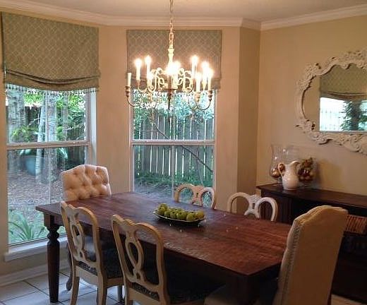 off kitchen dining with beautiful view of back yard