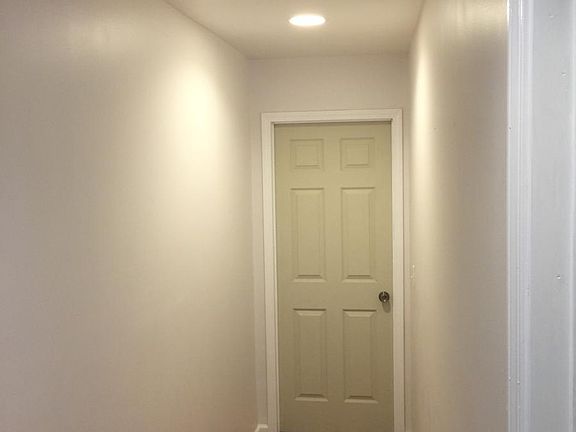 Hallway, with recessed lighting.