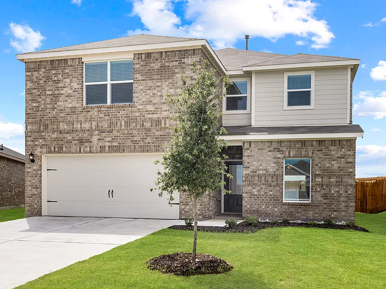 The Driftwood is a beautiful two-story, brick home with siding details.
