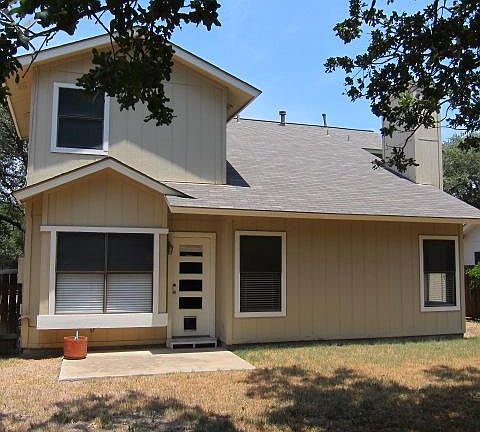 Fully fenced, large back yard with shade tree.
