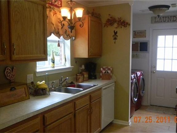 DECORATOR TOUCHES IN KTICHEN - LAUNDRY AREA BY BACK DOOR THAT LEADS TO THE GARAGE