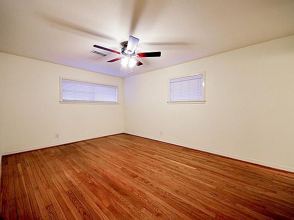 Bedroom with hardwoods