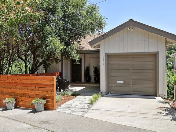 Garage and large parking area to left