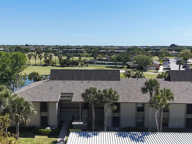 FIRST FLOOR - location, location! Just steps to clubhouse, heated pool, driving range, pro shop, pickle ball & much more!