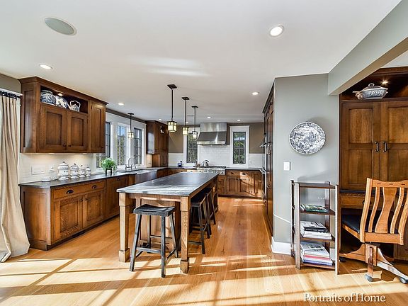 Check out the custom Quarter-Sawn Oak Built-in Computer/Work Station. A sliding door leads to the ba