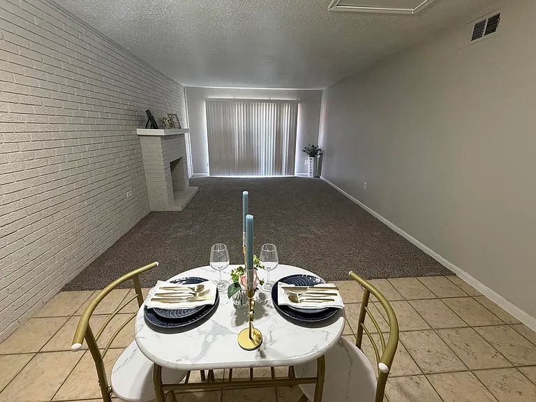 Enjoy an intimate dinner for two in a spacious dining area designed for comfort and elegance!