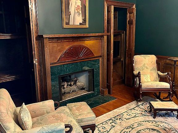 Library with gas fireplace. 