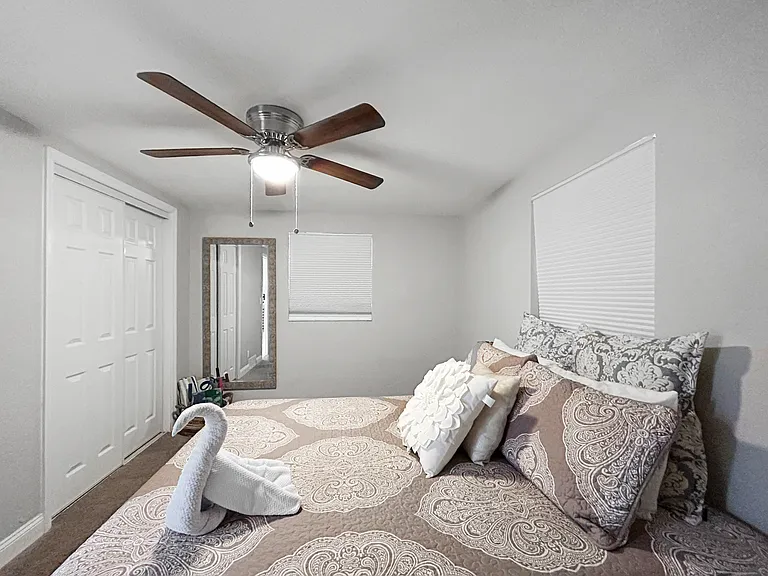 Master Bedroom
Peaceful bedroom with a ceiling fan, natural light, and a calm, neutral palette. A restful space to unwind at the end of the day.