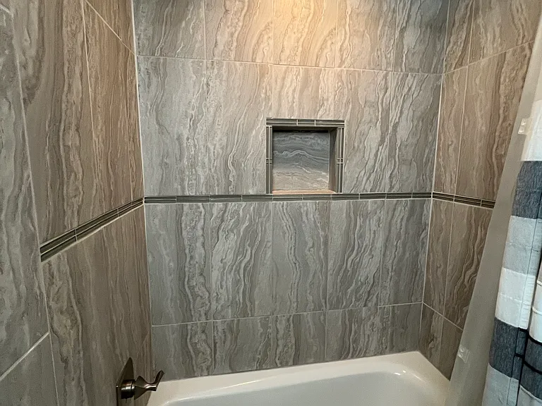 Close-up of shower in second full bath