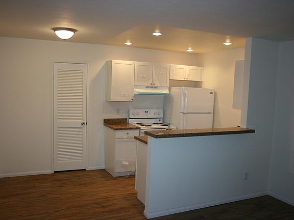stand in the living room looking into the kitchen