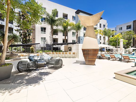 Outdoor Seating Area and Pool Deck | Elan Huntington Beach | Apartments in Huntington Beach, CA
