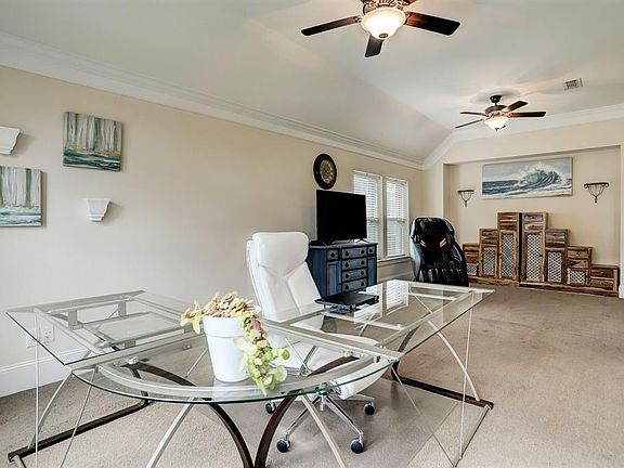 As you walk in you will be greeted by the study or office space and the formal dining room, currently being used as an additional living area.