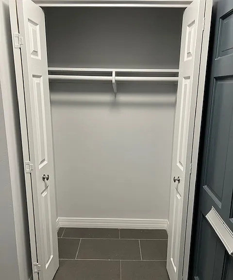 Living Room: Front Door Entry Way, Entry Way Light, Front Entry Closet, Tile and Grout Flooring, Freshly Painted Ceiling, Walls, Baseboards, Doors and Moldings.
