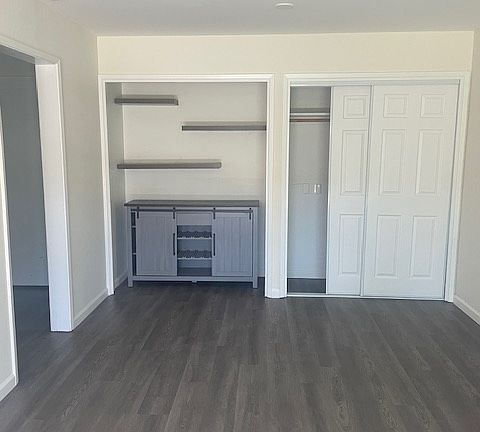 Dining room with ceiling fan and closets