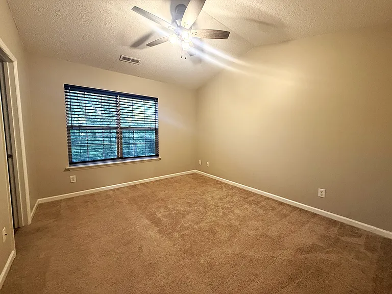 2nd Bedroom also features vaulted ceilings, private bath, and walk-in closet.