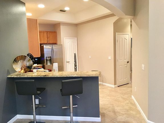 Bar with granite and kitchen