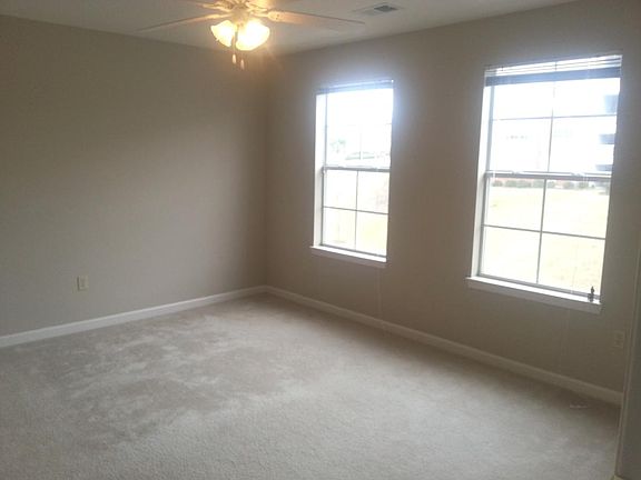 1st master bedroom 2 windows and fan