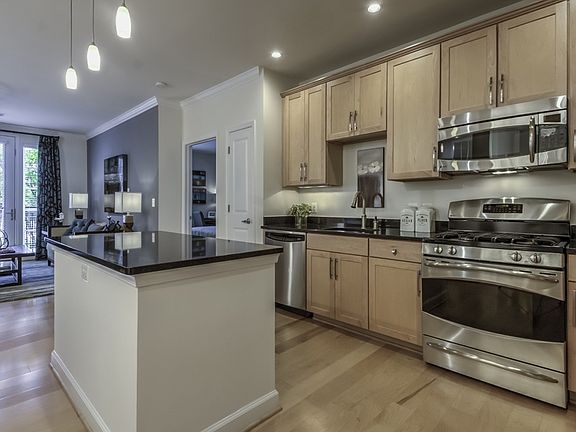 Gourmet kitchens with 42" wood cabinets and granite countertops