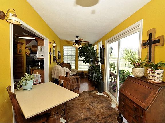 This is the sun room. This is a very bright happy room that has views of the garden and the pool.