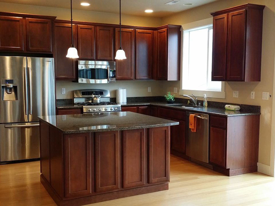 Kitchen with stainless steel appliances and granite countert