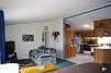 The super spacious living room has high ceilings & VIEWS of the valley!