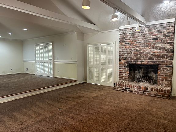 Dining room or home office and great room. Sliding glass doors open to deck.