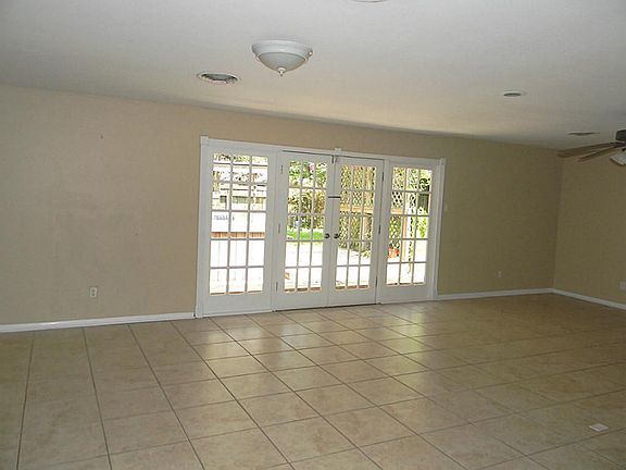 French doors looking out to the hot tub & back yard.