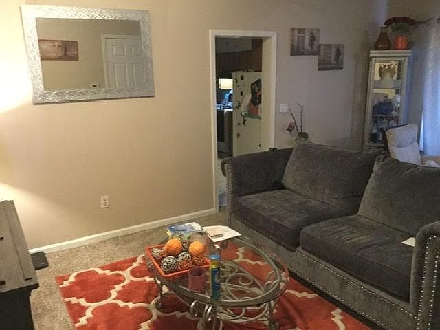 Front room with door to kitchen.