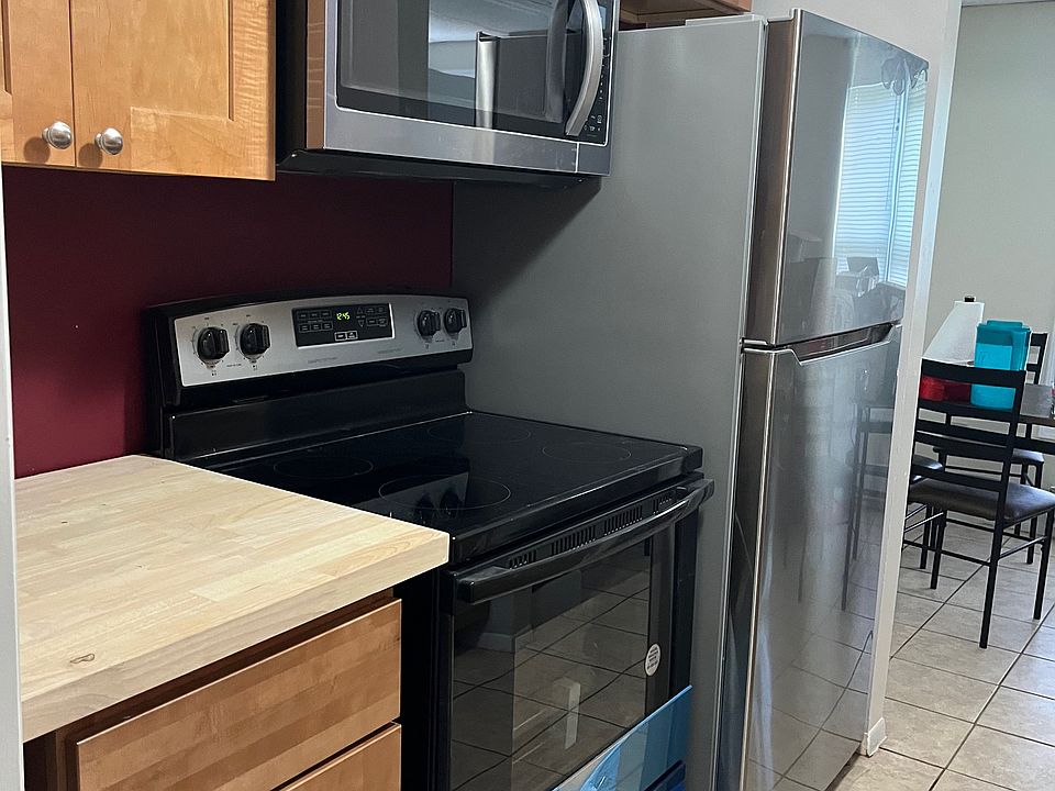 New stainless appliances including over the range microwave. The blue you see on the appliances is the protective wrapper. They are stainless like the fridge and not blue.