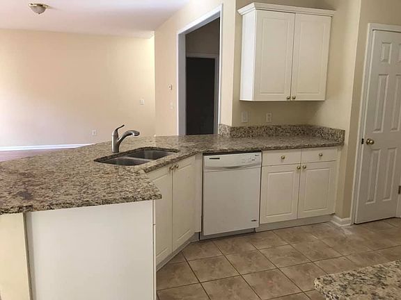 Recently updated kitchen countertops and tile kitchen flooring.