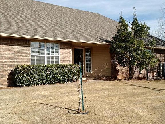 Front of home, facing green space