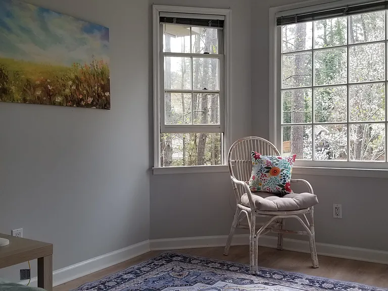 Cherry blossom trees beyond the bay window.