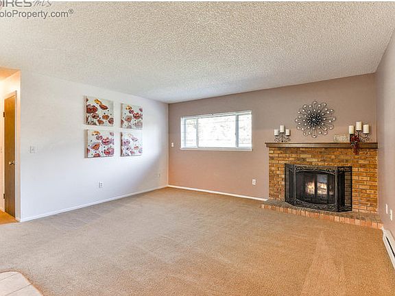 Living room with wood burning fireplace