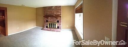 Living room and dining area w/ fireplace
