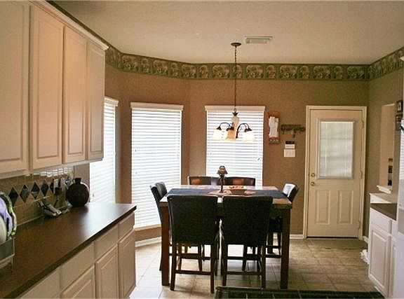 Nice breakfast area with a bay window.