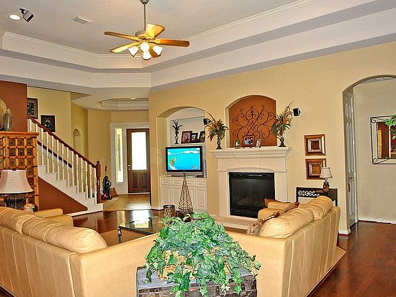 Nice open living area w/built-ins and stone fireplace 