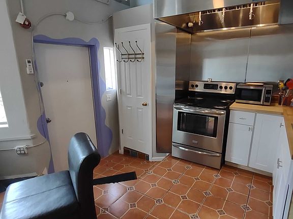 Front closet for clothes and/or pantry between kitchen and front door.