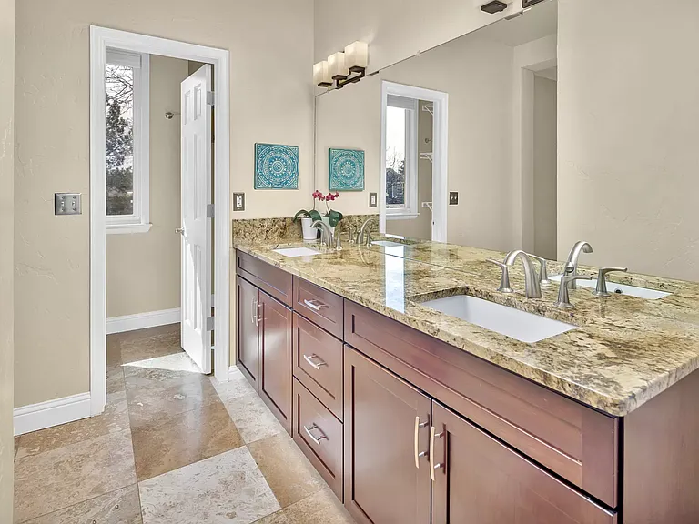 Sunny master bath with walk-in closet
