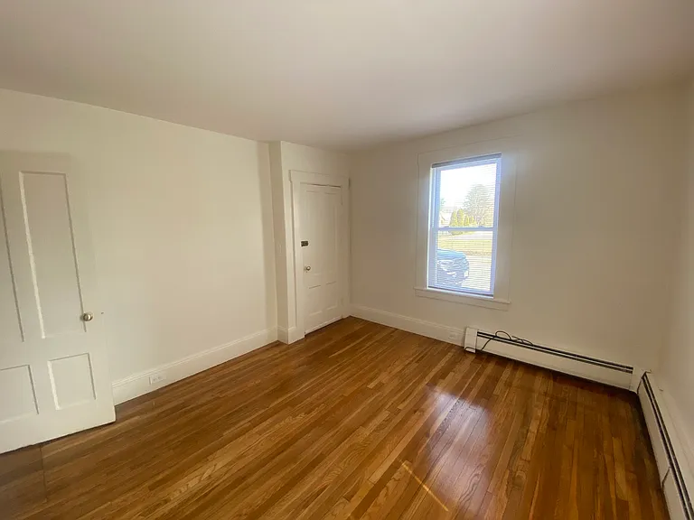 Large living room with gleaming hw floors