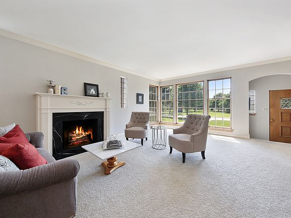 Lovely Living Room with Marble Surround Fireplace