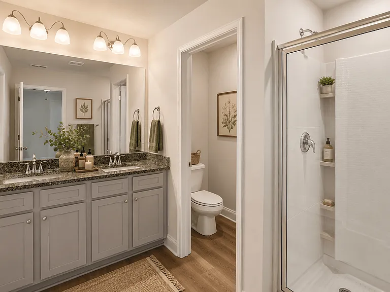 Primary Suite featuring a walk in shower.