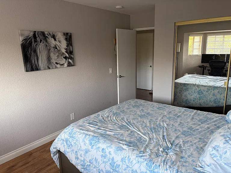 View of bedroom from the bathroom side