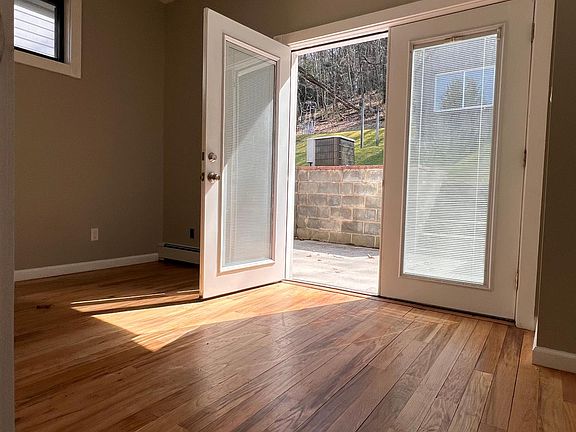 Main floor bedroom or office with exit of the back outdoor area