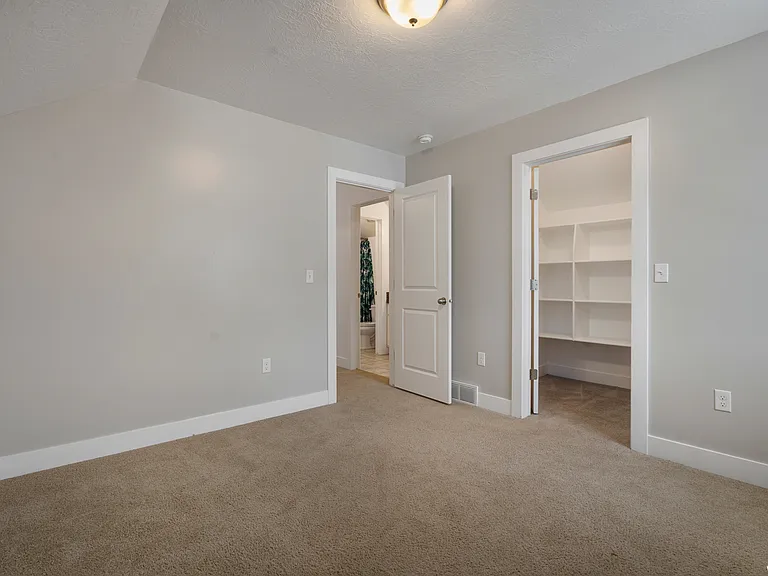 Upstairs bedroom number 2 with walk-in closet.