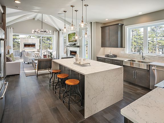 Kitchen opens to great room and outdoor living
