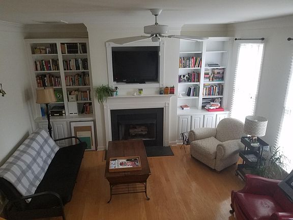 Living room with gas fireplace & built in bookshelves