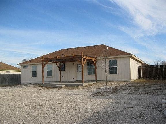 Rear, concrete covered patio
