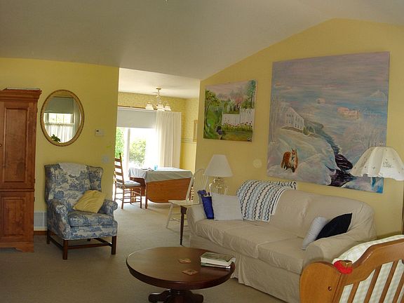 Spaciousness is emphasized in the large living room with a vaulted ceiling.